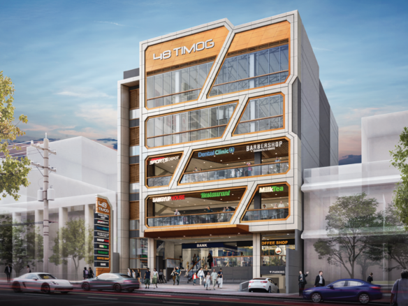 Modern multi-story commercial building with a bold orange geometric façade and large glass windows, housing shops like a dentist, barber, restaurant, and more on a busy street.