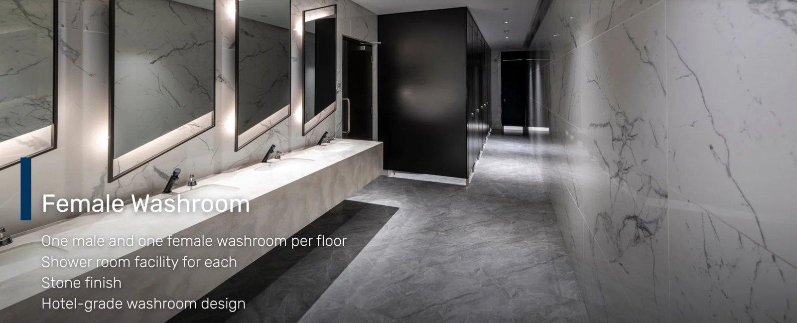 Screenshot_18-6-2026_172244_glas.ph Text reads 'Female Washroom'; marble-tiled bathroom with multiple sinks, mirrors, and a black divider wall along the counter.